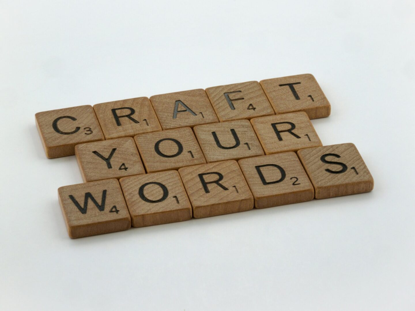 Scrabble tiles spelling "Craft your words"