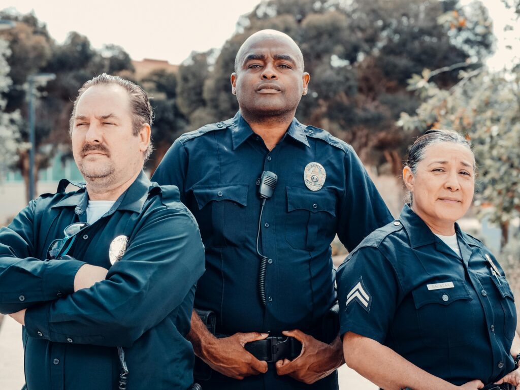 Three police officers standing together.