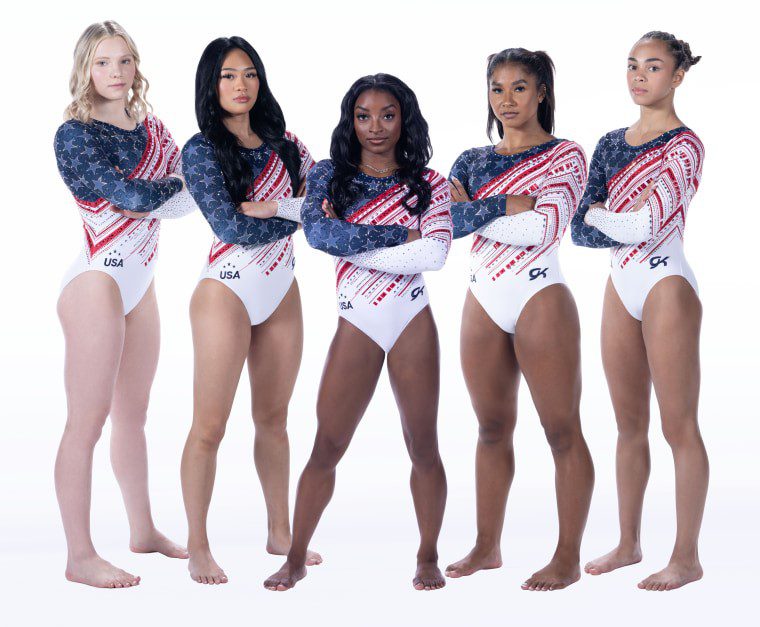 Five US gymnasts in patriotic leotards.