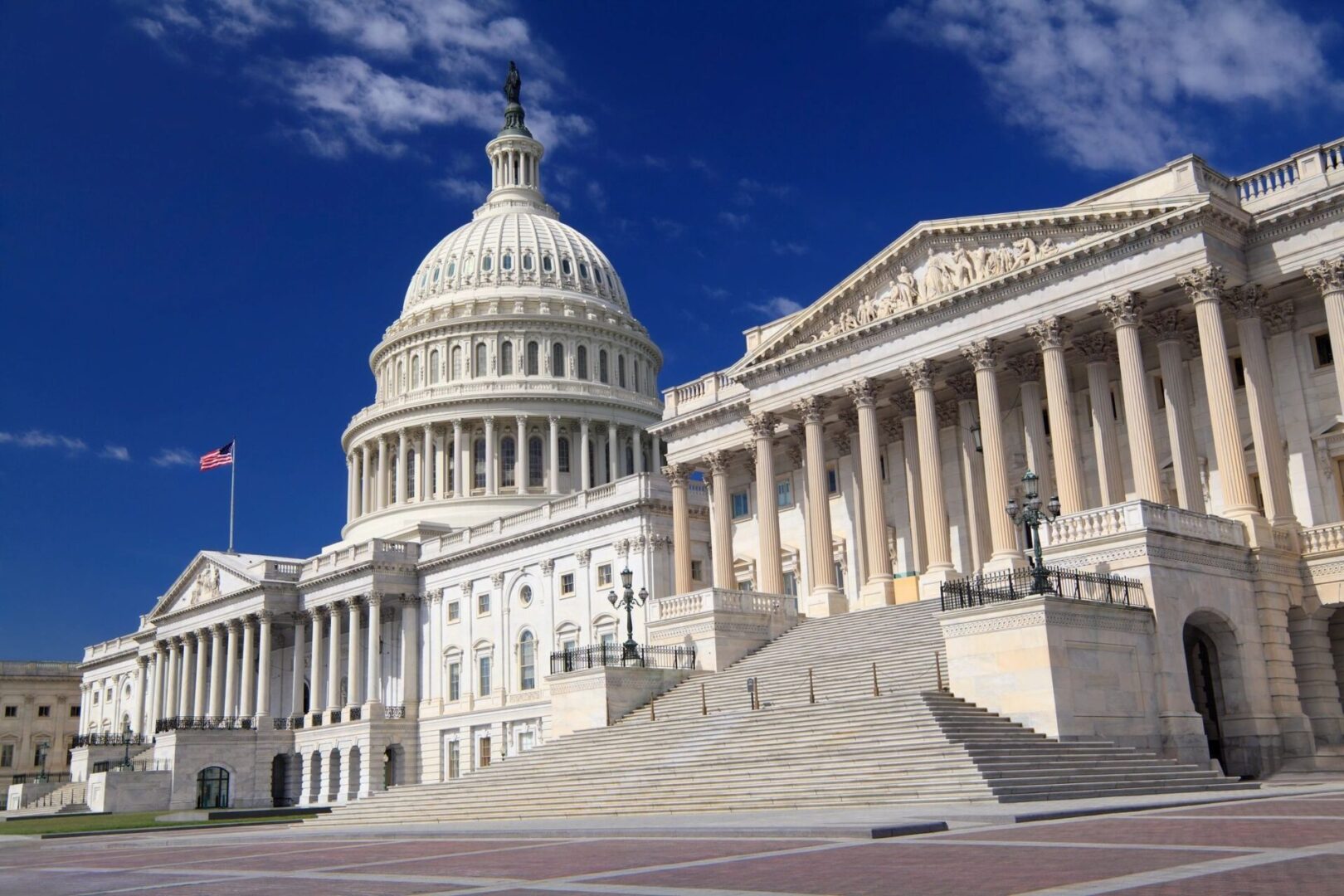 US Capitol building with American flag.